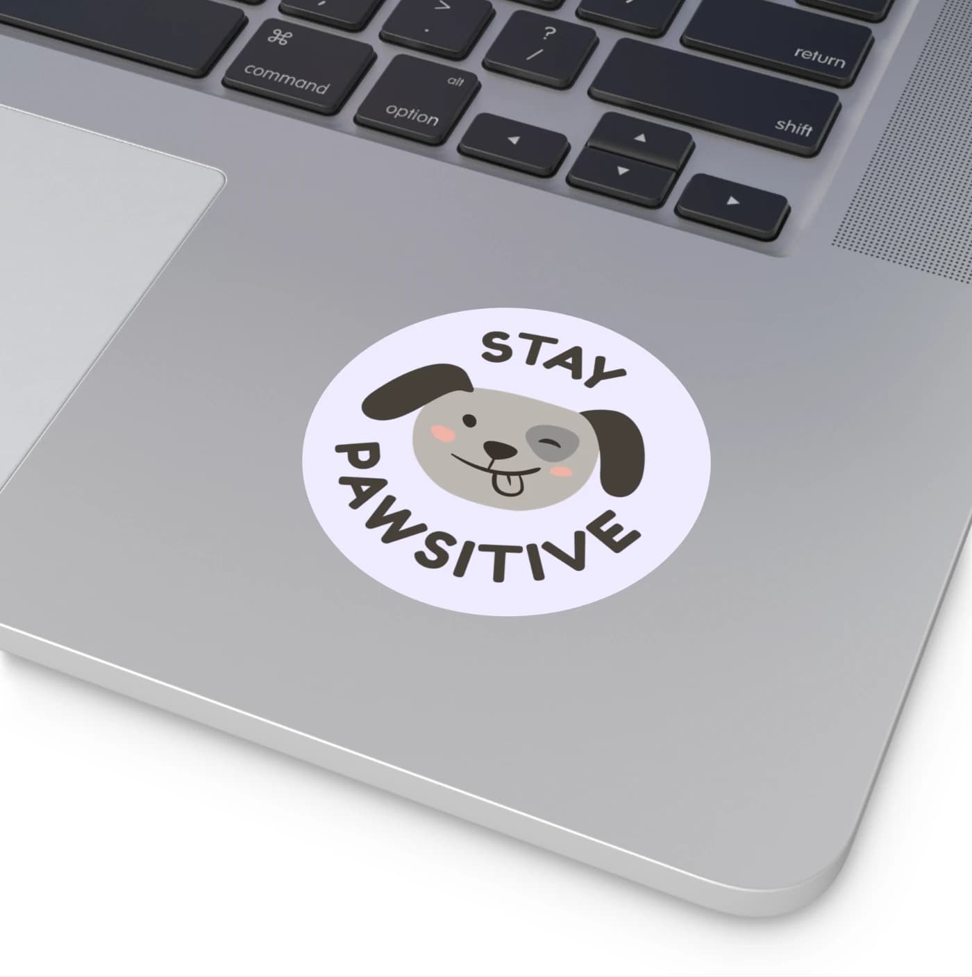 A round sticker with its safe area marked. Artwork runs past the trim; anything you would miss stays inside the dashed line.